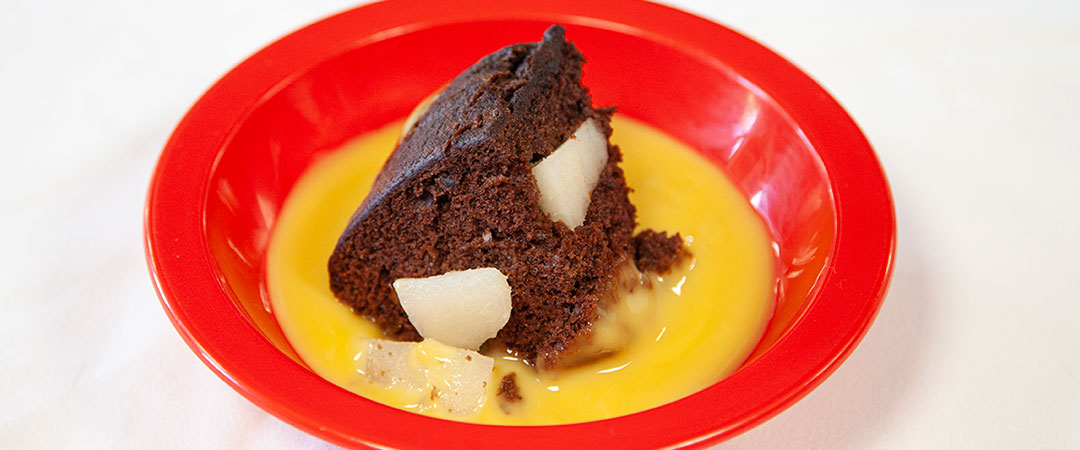 Pear and chocolate sponge with chocolate sauce