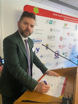 Cllr Anthony Hunt signing the Charter for Families Bereaved by Public Tragedy