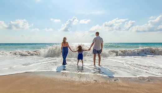 Family walking on the beach