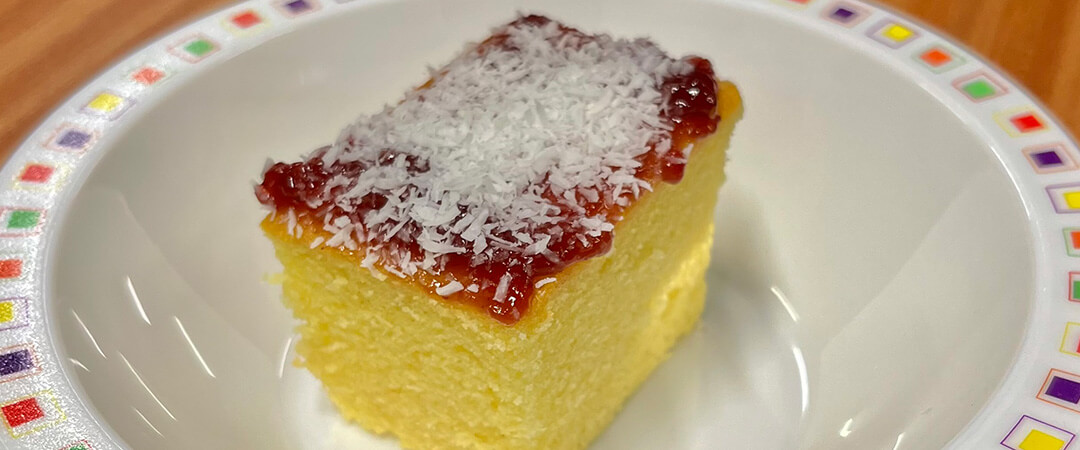 Jam and coconut sponge with custard