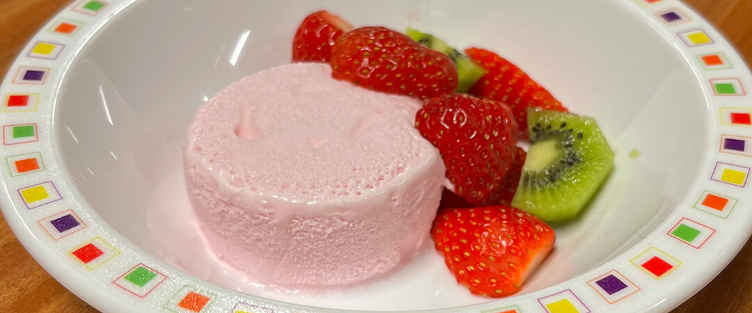 Strawberry yoghurt flavour ice cream with fruit