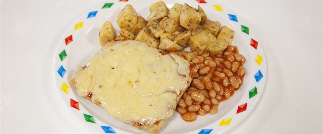 Cheese and tomato pizza, herby diced potatoes, baked beans or peas