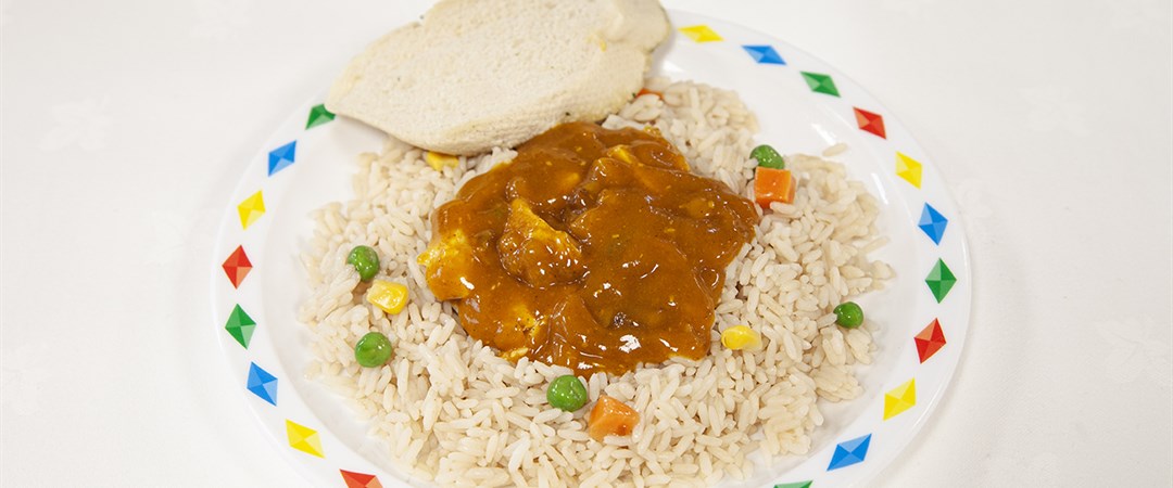 Homemade chicken korma, savoury rice, naan and veg selection