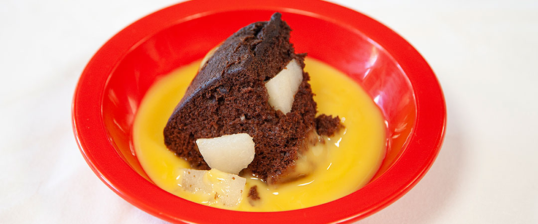 Pear and chocolate sponge with chocolate sauce