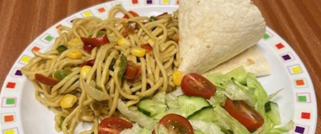 Vegetable noodles with tortilla wrap (V), herby diced potatoes, peas or mixed salad