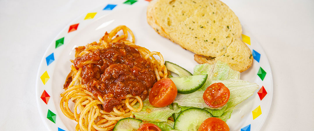 Veggie bolognese with seasonal vegetables and garlic bread