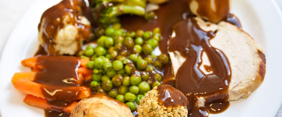 Roast Turkey with Stuffing with Roast and Boiled Potatoes, Vegetables and Gravy