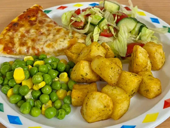 Cheese and tomato pizza served with diced potatoes, salad, peas and sweetcorn