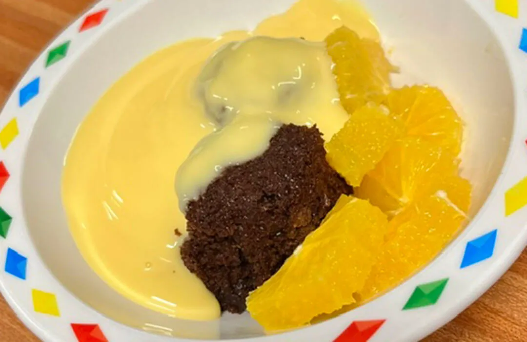 Chocolate orange beet cake with fruit and custard