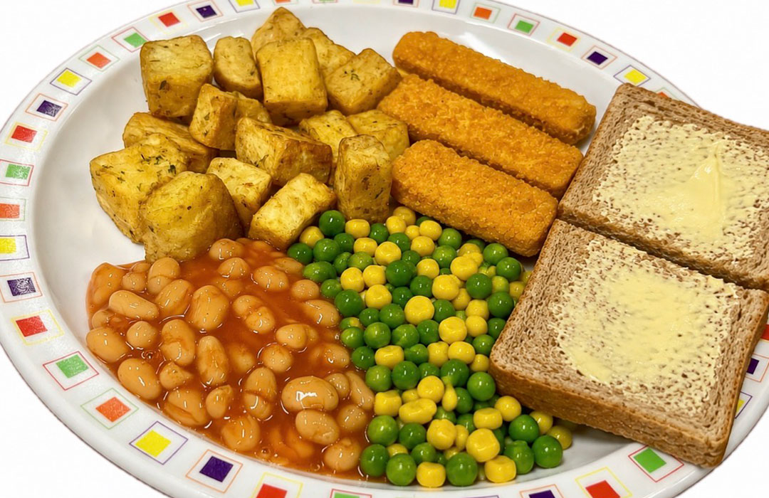 Cod fish fingers served with herby diced potatoes, peas and sweetcorn, bread and spread