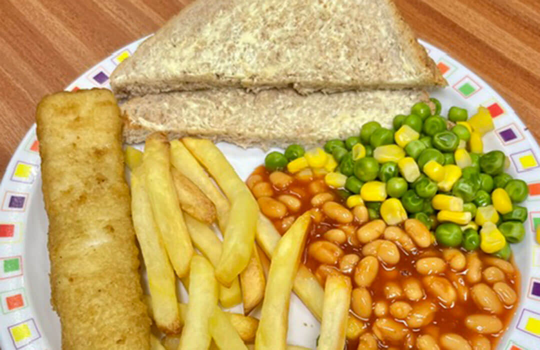 Jumbo fish finger served with chips, peas and sweetcorn or baked beans, bread and spread