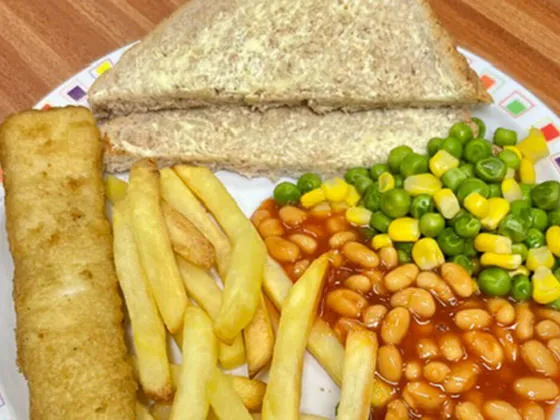 Jumbo fish finger served with chips, peas and sweetcorn or baked beans, bread and spread