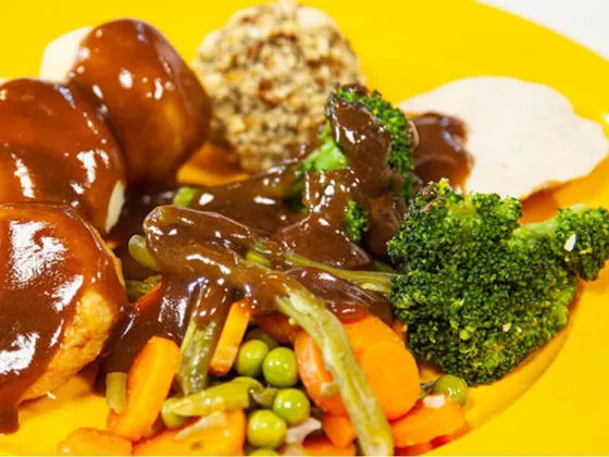 Roast turkey with stuffing with roast and boiled potatoes, vegetables and gravy