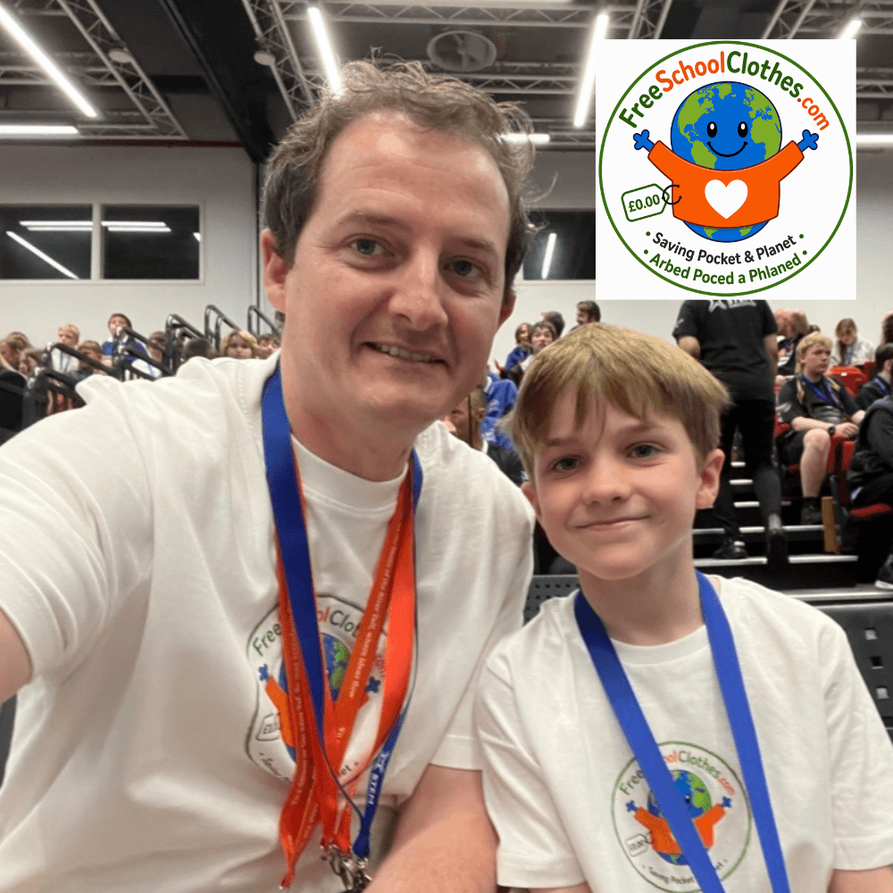 Jon Evans, founder of freeschoolclothes.com, pictured with young boy in a school hall