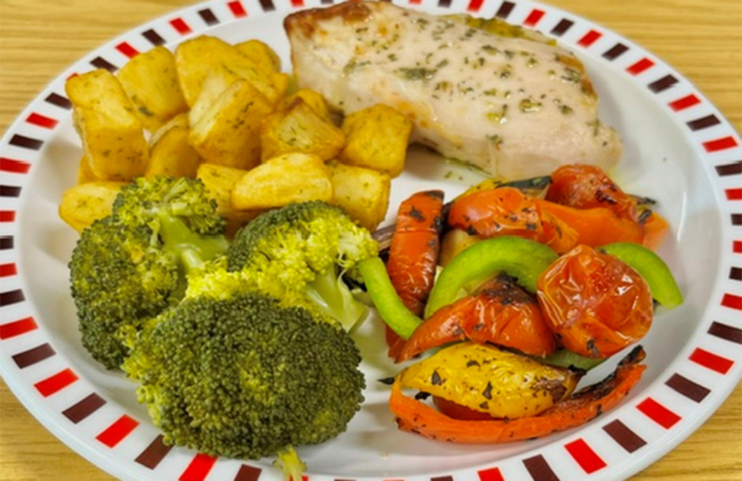 Garlic chicken fillet served with diced potatoes, broccoli and mediterranean roasted vegetables
