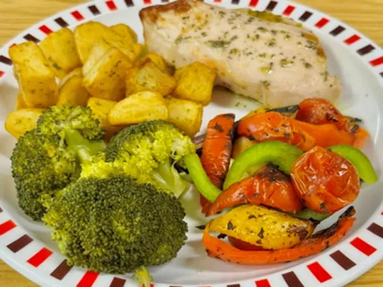 Garlic chicken fillet served with diced potatoes, broccoli and mediterranean roasted vegetables