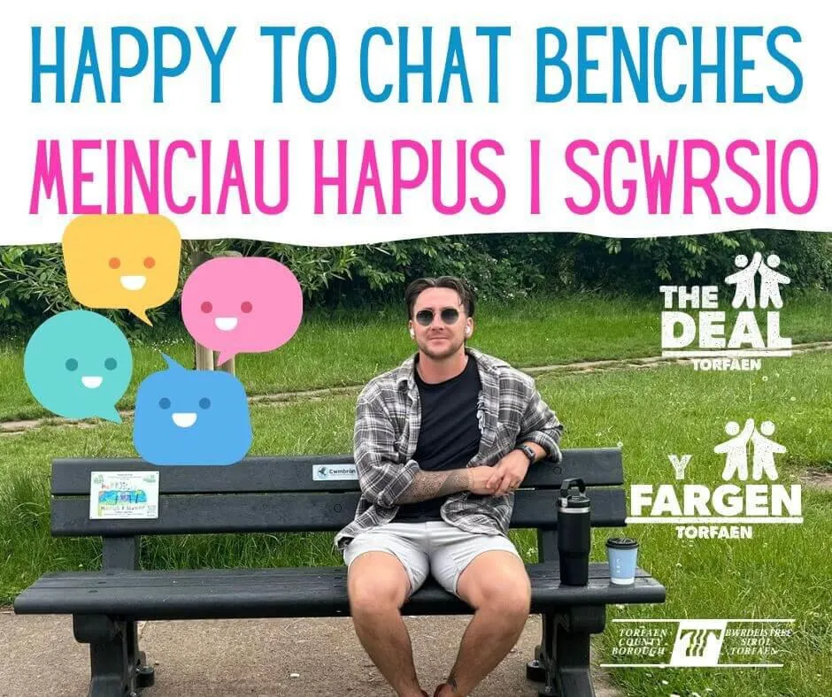 Gentleman sitting on a Happy to Chat bench