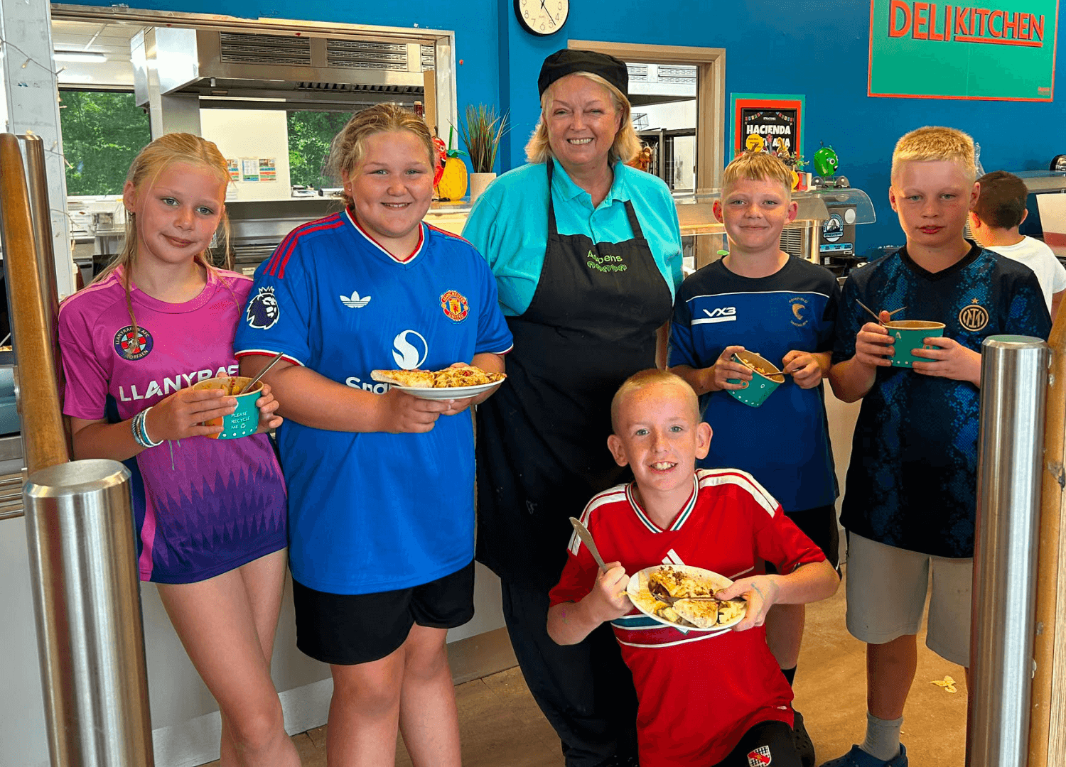 Children enjoying lunch at the moving up camp