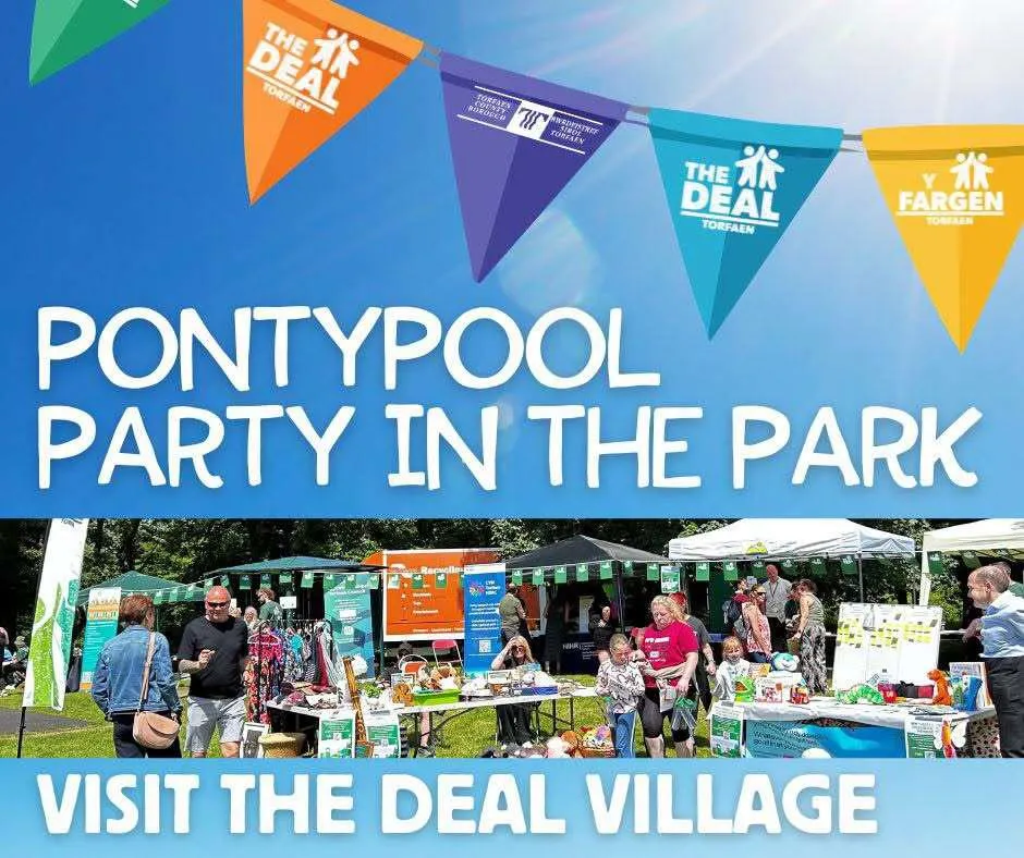 Colorful “Deal” banners above stalls at Pontypool Party in the Park