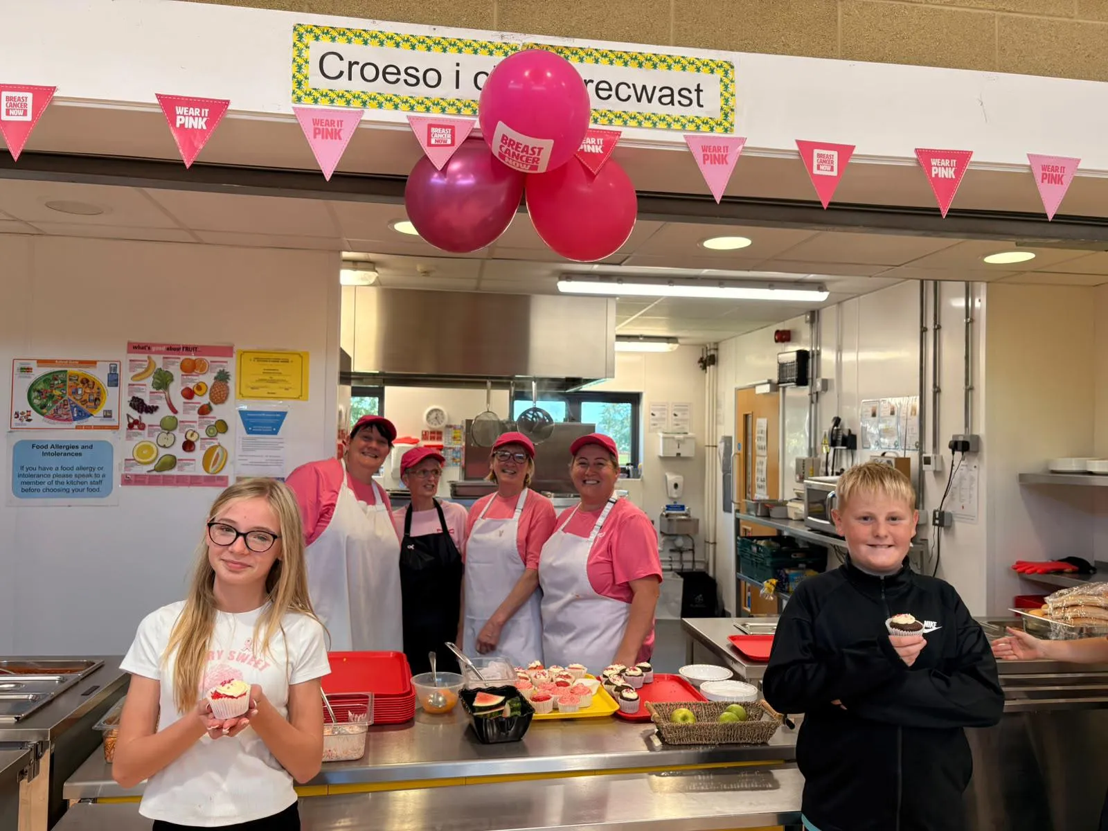 catering team wearing pink